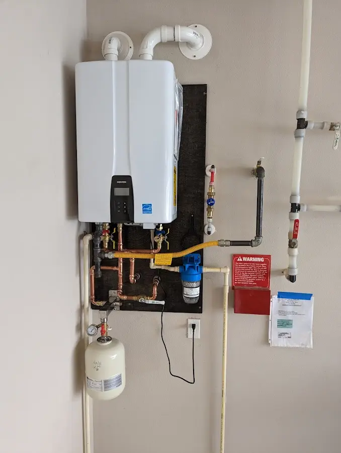 Professional plumber installing copper piping in a Fellsmere home